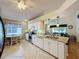 Open kitchen featuring granite countertops, stainless appliances, and a breakfast nook for casual dining at 3706 Doune Way, Clermont, FL 34711