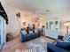 Inviting living room showcasing bright decor, and seamless flow into the dining area and kitchen at 3706 Doune Way, Clermont, FL 34711