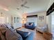 Cozy living room featuring a china cabinet, comfortable seating, and stylish decor at 3706 Doune Way, Clermont, FL 34711