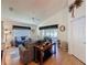Inviting living room with wood floors, high ceilings, and a sliding glass door to the screened patio and yard at 3706 Doune Way, Clermont, FL 34711