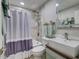 Bathroom featuring tiled shower, modern fixtures, decorative towels, and a vessel sink at 37149 Grays Airport, Lady Lake, FL 32159