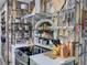 The kitchen shows custom wood-look walls, a stainless steel stove, and open shelving for spices and cookware at 37149 Grays Airport, Lady Lake, FL 32159