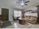 Inviting living room with neutral tones, featuring a cozy couch and unique coffee table, creating a comfortable space at 37149 Grays Airport, Lady Lake, FL 32159