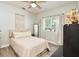 Bright bedroom featuring wood-look floors, a ceiling fan, and a window at 3732 Fallscrest Cir, Clermont, FL 34711