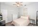 Comfortable bedroom featuring wood-look floors, a ceiling fan, and a closet at 3732 Fallscrest Cir, Clermont, FL 34711