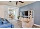 Comfortable living room showcasing an open floor plan with views into other living areas and an entertainment center at 3732 Fallscrest Cir, Clermont, FL 34711