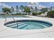 Inviting hot tub and pool area with lounge chairs, perfect for relaxing and enjoying the community amenities at 3732 Fallscrest Cir, Clermont, FL 34711