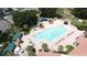 Aerial shot of a pool, chaise lounges and umbrellas at 3821 Doune Way, Clermont, FL 34711