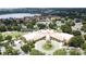 Aerial view of a pool, recreation center, lake and trees at 3821 Doune Way, Clermont, FL 34711