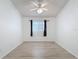Bright bedroom with vaulted ceilings, ceiling fan, and neutral decor at 3821 Doune Way, Clermont, FL 34711