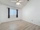 Spacious bedroom with vaulted ceiling, ceiling fan and a window at 3821 Doune Way, Clermont, FL 34711