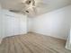 Clean bedroom with closet, white walls, and laminate flooring at 3821 Doune Way, Clermont, FL 34711