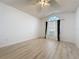 Spacious bedroom with a large window dressed with black curtains and a ceiling fan at 3821 Doune Way, Clermont, FL 34711