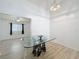 Bright dining area with decorative chandelier and large table, with adjacent living space at 3821 Doune Way, Clermont, FL 34711