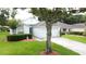 Well-maintained single Gathering home featuring a lush front lawn and two car garage at 3821 Doune Way, Clermont, FL 34711
