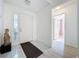 Inviting foyer with tile floors and a view into the adjacent bathroom at 3821 Doune Way, Clermont, FL 34711