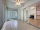 Enclosed lanai featuring a ceiling fan, tiled floor, and sliding glass doors to the interior at 3821 Doune Way, Clermont, FL 34711