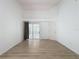 Large main bedroom with hardwood floors, great light, and a view of the sun room at 3821 Doune Way, Clermont, FL 34711