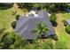 Gorgeous aerial view of a home with a well-maintained roof, landscaping, and ample greenery at 39634 Harbor Hills Blvd, Lady Lake, FL 32159