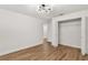 Bedroom featuring hardwood flooring and a closet with wire racks at 39634 Harbor Hills Blvd, Lady Lake, FL 32159