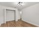 Bedroom featuring hardwood flooring and a closet with a wire rack system at 39634 Harbor Hills Blvd, Lady Lake, FL 32159