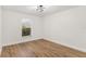 Bright bedroom with hardwood flooring and natural light from the window at 39634 Harbor Hills Blvd, Lady Lake, FL 32159