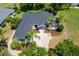 Stunning aerial view of a beautifully landscaped single-Gathering home with a well-manicured lawn and a classic driveway at 39634 Harbor Hills Blvd, Lady Lake, FL 32159