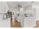 This modern kitchen has white cabinets, quartz countertops, and stainless steel appliances at 39634 Harbor Hills Blvd, Lady Lake, FL 32159