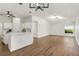 Open-concept living space featuring a spacious kitchen with views into a well-lit, open living area at 39634 Harbor Hills Blvd, Lady Lake, FL 32159