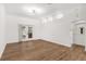 Bright and airy living room with wood-look floors and access to the backyard at 39634 Harbor Hills Blvd, Lady Lake, FL 32159