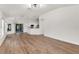 Expansive open-concept living area with wood flooring and natural light, great for entertaining at 39634 Harbor Hills Blvd, Lady Lake, FL 32159