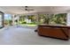 A screened-in porch features a hot tub, providing a relaxing and private outdoor space with pleasant views at 39634 Harbor Hills Blvd, Lady Lake, FL 32159