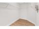 Bright walk-in closet with wire shelving and attractive wood-look flooring at 39634 Harbor Hills Blvd, Lady Lake, FL 32159