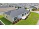 Ariel view of a single-story house with a well maintained yard, and a screened porch at 3984 Kanawha Pl, The Villages, FL 32163