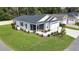 Beautiful single-story home with a manicured lawn, screened porch and landscaped backyard at 3984 Kanawha Pl, The Villages, FL 32163