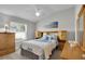 Comfortable bedroom with ceiling fan, large window, and decor at 3984 Kanawha Pl, The Villages, FL 32163