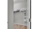 Walk-in closet with wire shelving and carpeted floors at 3984 Kanawha Pl, The Villages, FL 32163