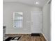View of front entry showing clean floors, window and door with secure lock at 3984 Kanawha Pl, The Villages, FL 32163