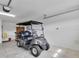 Clean garage featuring an electric golf cart at 3984 Kanawha Pl, The Villages, FL 32163