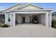 Exterior of garage with electric golf cart at 3984 Kanawha Pl, The Villages, FL 32163
