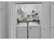 Laundry room with washer, dryer, and shelving for storage at 3984 Kanawha Pl, The Villages, FL 32163