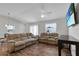 Living room with neutral walls, wood-look floors and a ceiling fan at 3984 Kanawha Pl, The Villages, FL 32163