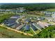 Aerial view of a residential community showcasing well-manicured lawns and modern home designs at 4451 Elijah Loop, The Villages, FL 32163