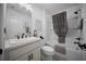 Well-lit bathroom featuring a tub-shower combination and elegant fixtures for a relaxing experience at 4451 Elijah Loop, The Villages, FL 32163