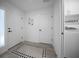 Convenient laundry area with modern washer and dryer, ample storage, and stylish design at 4451 Elijah Loop, The Villages, FL 32163