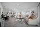 The open living space includes a kitchen with bar seating and offers lots of natural light at 4451 Elijah Loop, The Villages, FL 32163