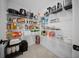 The walk-in pantry is filled with shelves for optimized food storage at 4451 Elijah Loop, The Villages, FL 32163