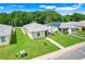 Aerial view of a well-maintained home in a neighborhood with beautiful green spaces at 4649 College Dr, Orlando, FL 32811