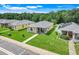 Aerial view of a home with well-manicured lawn in a peaceful neighborhood setting at 4649 College Dr, Orlando, FL 32811