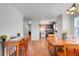 Inviting dining area with hardwood floors, seamlessly connecting to the kitchen for easy entertaining at 4649 College Dr, Orlando, FL 32811